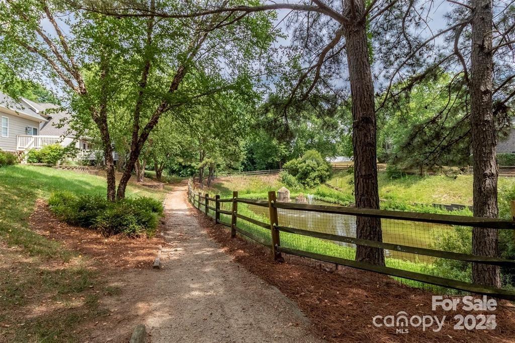 9065 Rosalyn Glen Road Cornelius, NC 28031 - Photo 35 of 35 a view of a yard with large trees