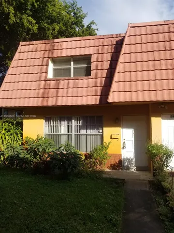 a view of a back yard of the house