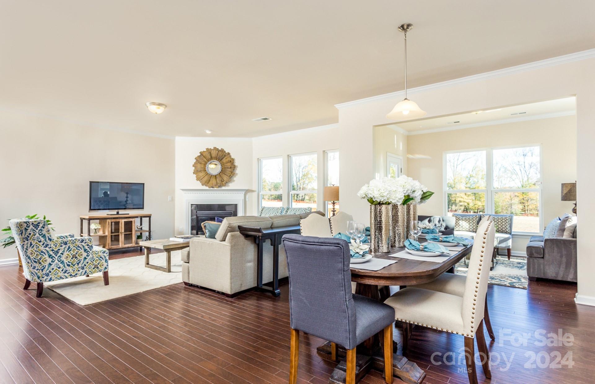 2233 Millenium Drive, Unit 13 Lancaster, SC 29720 - Photo 11 of 15 a view of a dining room with furniture and wooden floor