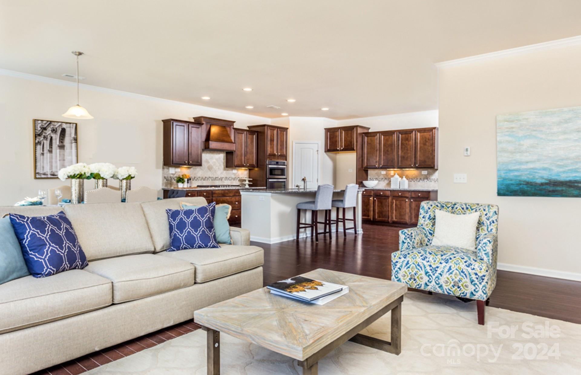 2233 Millenium Drive, Unit 13 Lancaster, SC 29720 - Photo 12 of 15 a living room with furniture and a wooden floor