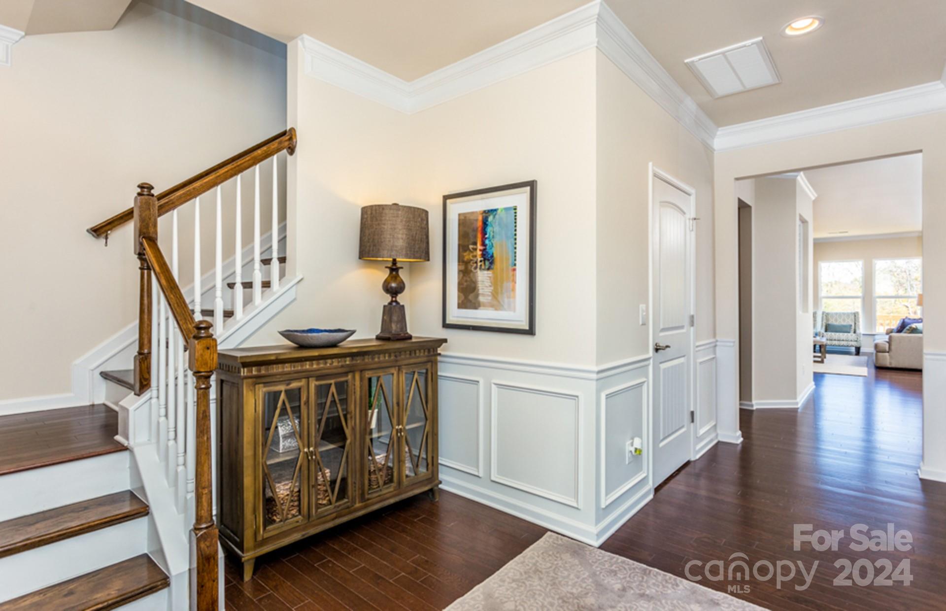 2233 Millenium Drive, Unit 13 Lancaster, SC 29720 - Photo 2 of 15 a view of an entryway with wooden floor and a livingroom view