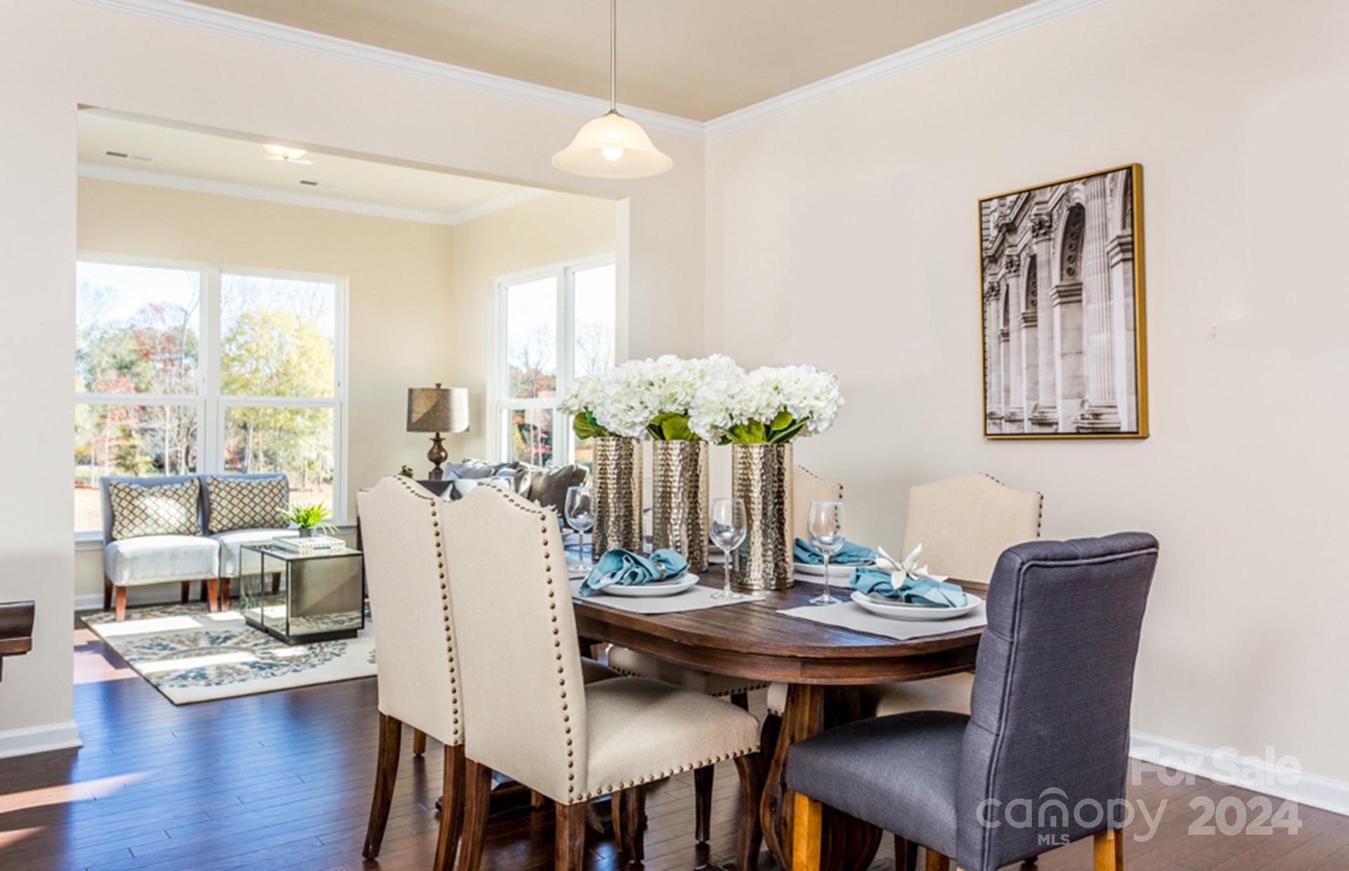 2233 Millenium Drive, Unit 13 Lancaster, SC 29720 - Photo 8 of 15 a view of a dining room with furniture window and wooden floor