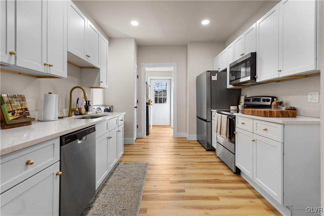 635 3rd Avenue Bethlehem, PA 18018 - Photo 6 of 18 a kitchen with stainless steel appliances granite countertop a refrigerator and a stove top oven
