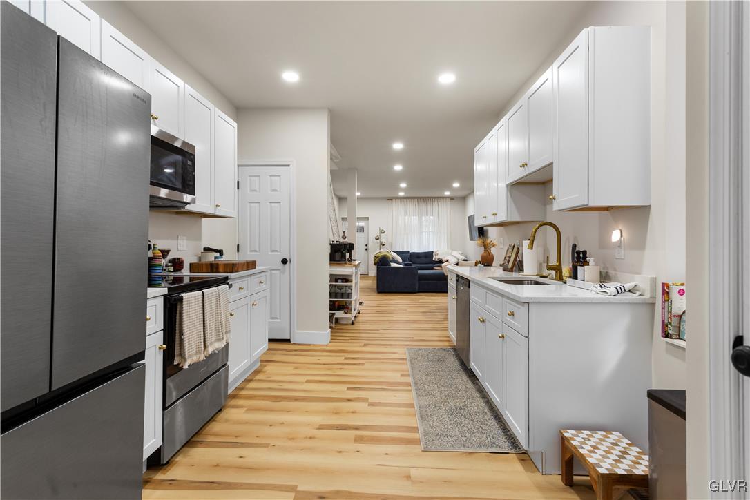 635 3rd Avenue Bethlehem, PA 18018 - Photo 7 of 18 a large kitchen with stainless steel appliances kitchen island granite countertop a large counter top stainless steel appliances and cabinets