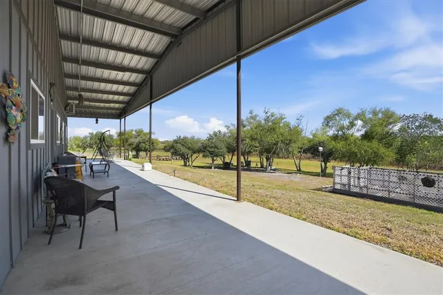 a spacious bedroom with a bed and ceiling fan