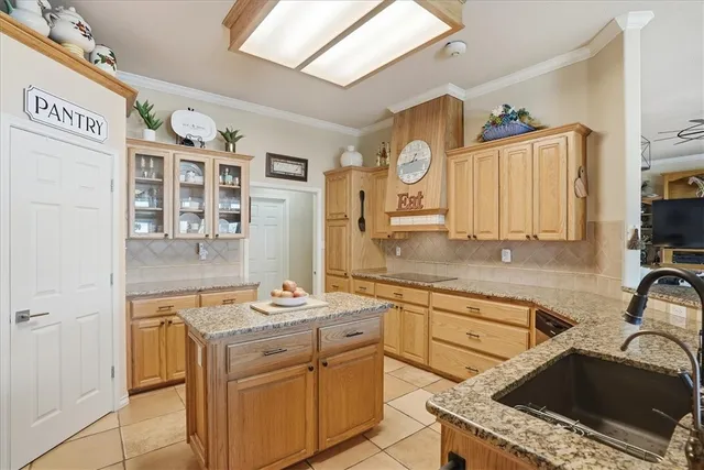 a kitchen that has a sink and a stove in it