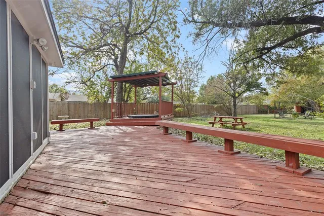 a view of backyard and tree