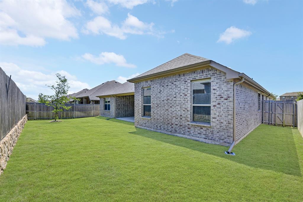 136 Gleeson Drive Red Oak, TX 75154 - Photo 36 of 40 a front view of a house with garden