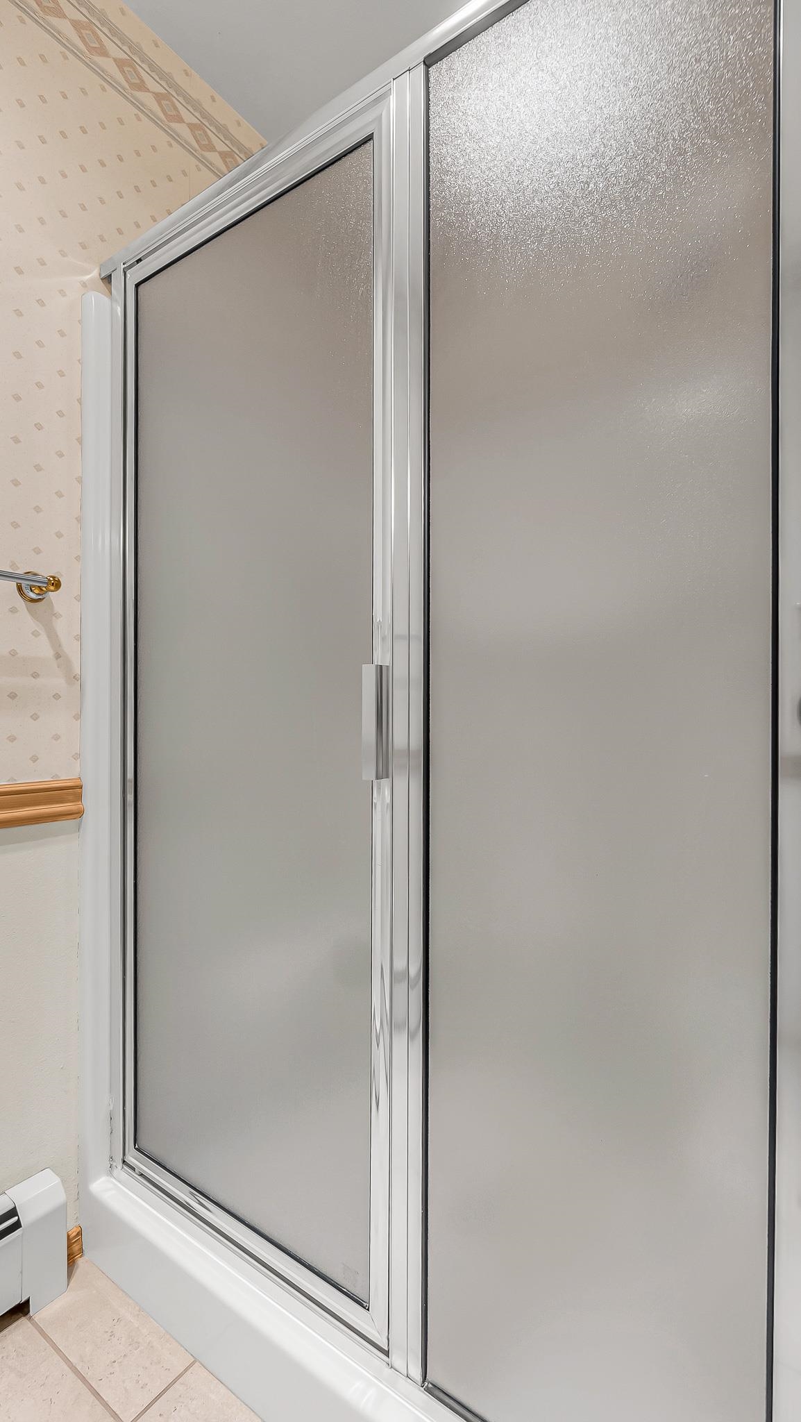 12 West Ridge Court Parachute, CO 81635 - Photo 14 of 37 a bathroom with a glass shower door