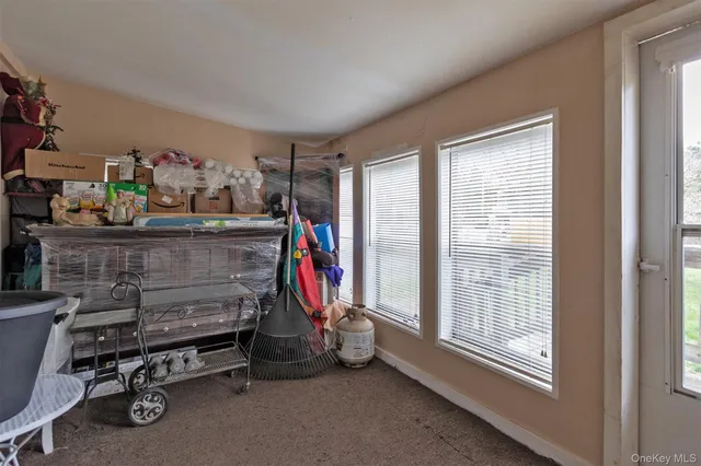 a view of a storage & utility room with a window