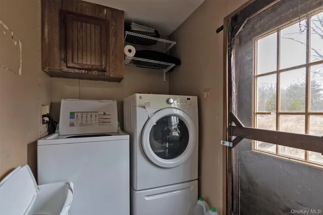a utility room with dryer and washer