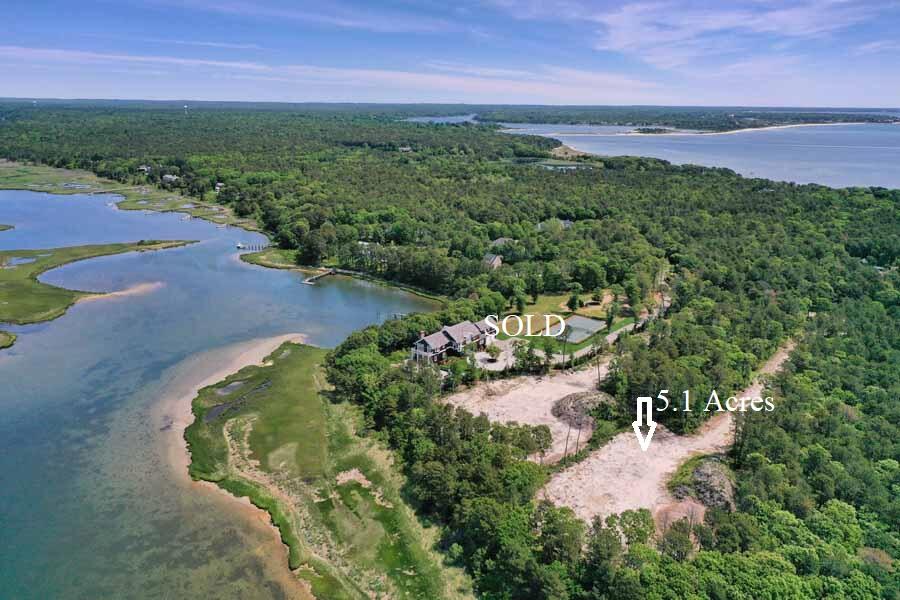 172 Vineyard Road Cotuit, MA 02635 - Photo 2 of 6 a view of a lake with a yard