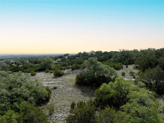 an aerial view of a house with mountain view