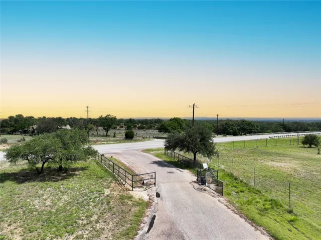 a view of a road with a trees in the background