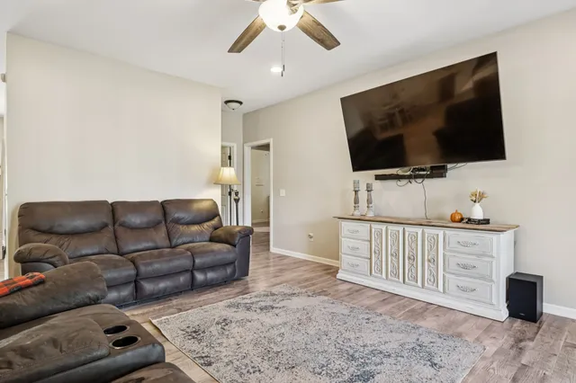 a view of a dining room with furniture and wooden floor