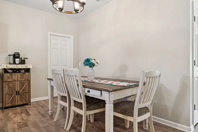 a kitchen with a refrigerator a microwave a sink and a stove