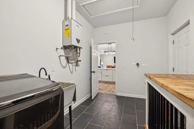 a bathroom with a sink a mirror and a window