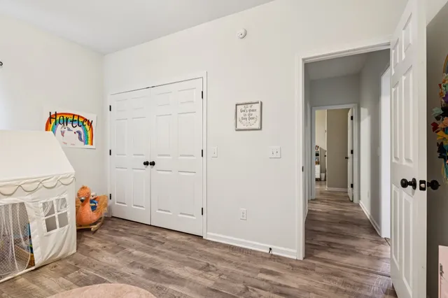 a view of a porch with furniture and garden