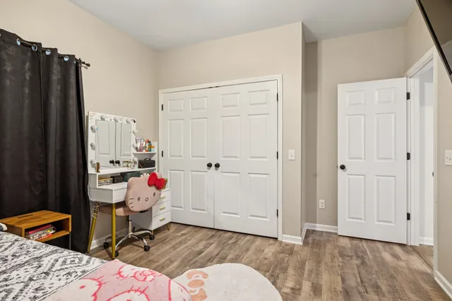 a view of a large garden with plants and large trees