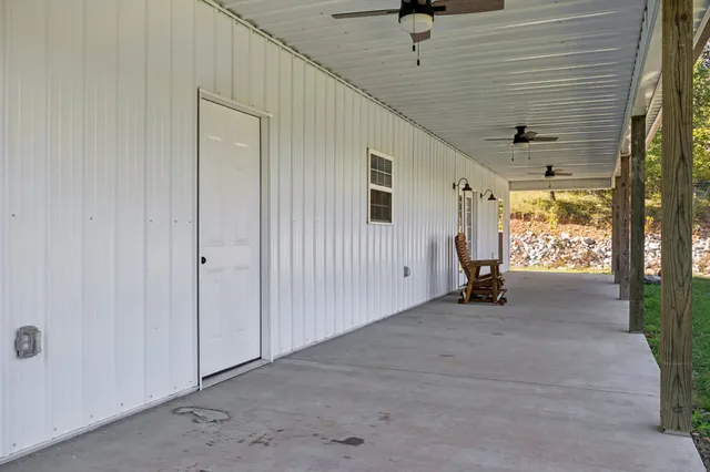 a white house with a big yard