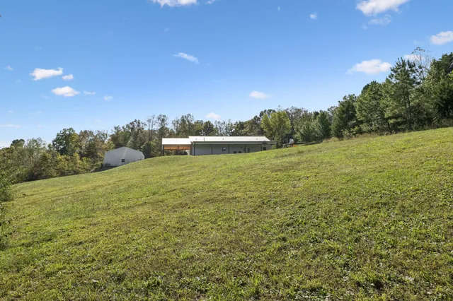 a view of a two chairs in the balcony