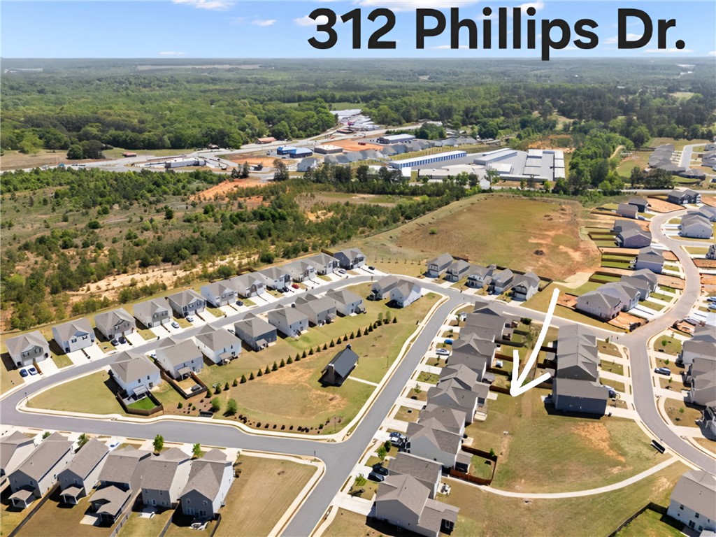 312 Phillips Drive Pendleton, SC 29670 - Photo 45 of 45 An aerial view showcases a residential community nestled amidst lush green landscapes.
