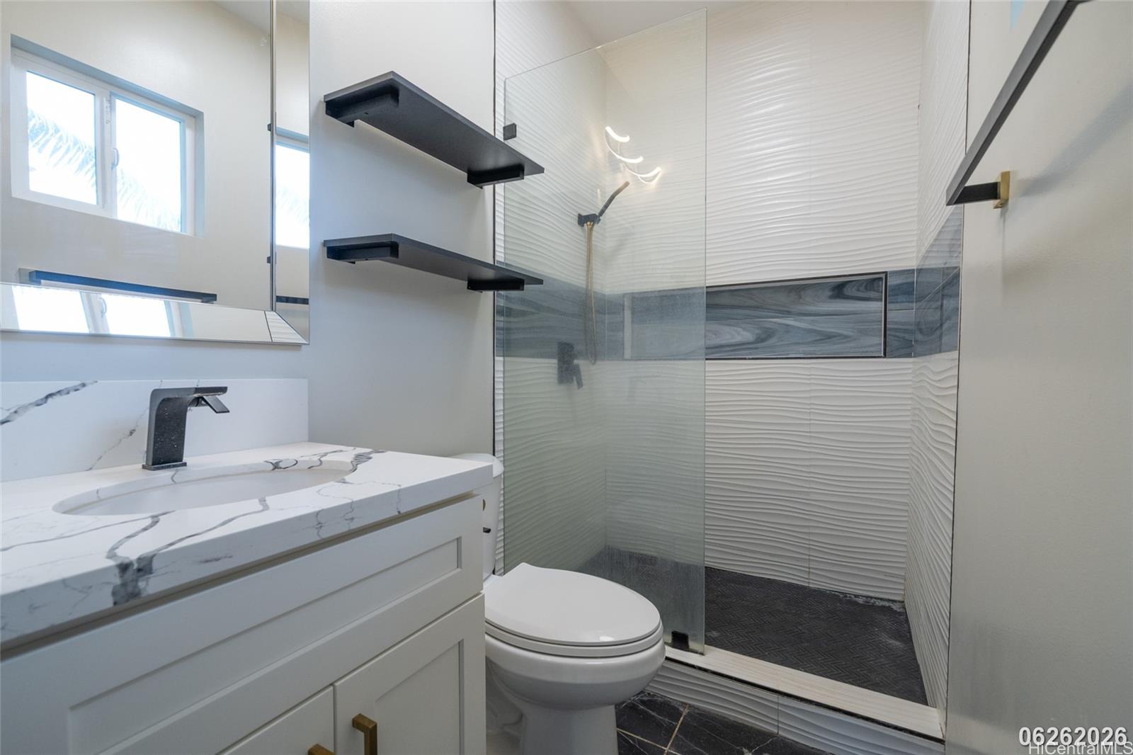 87-1409 Akowai Road Waianae, HI 96792 - Photo 25 of 25 a bathroom with a sink a toilet and a shower