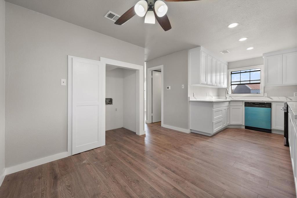 443 County Road 3799 Springtown, TX 76082 - Photo 13 of 33 Kitchen with white cabinetry, dishwashing machine, dark wood finished floors, ceiling fan, and recessed lighting