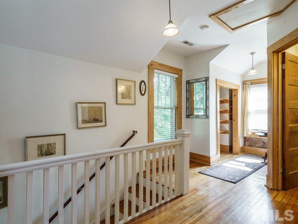 511 Florence Street Raleigh, NC 27603 - Photo 10 of 24 The bright upstairs hall opens to the MBR suite and a 2nd upstairs BR and full bath.