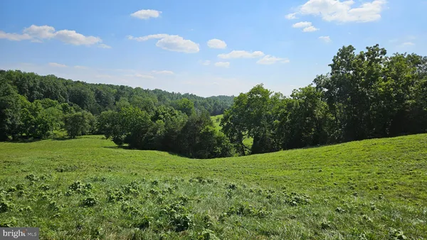 a view of a golf course with a lake