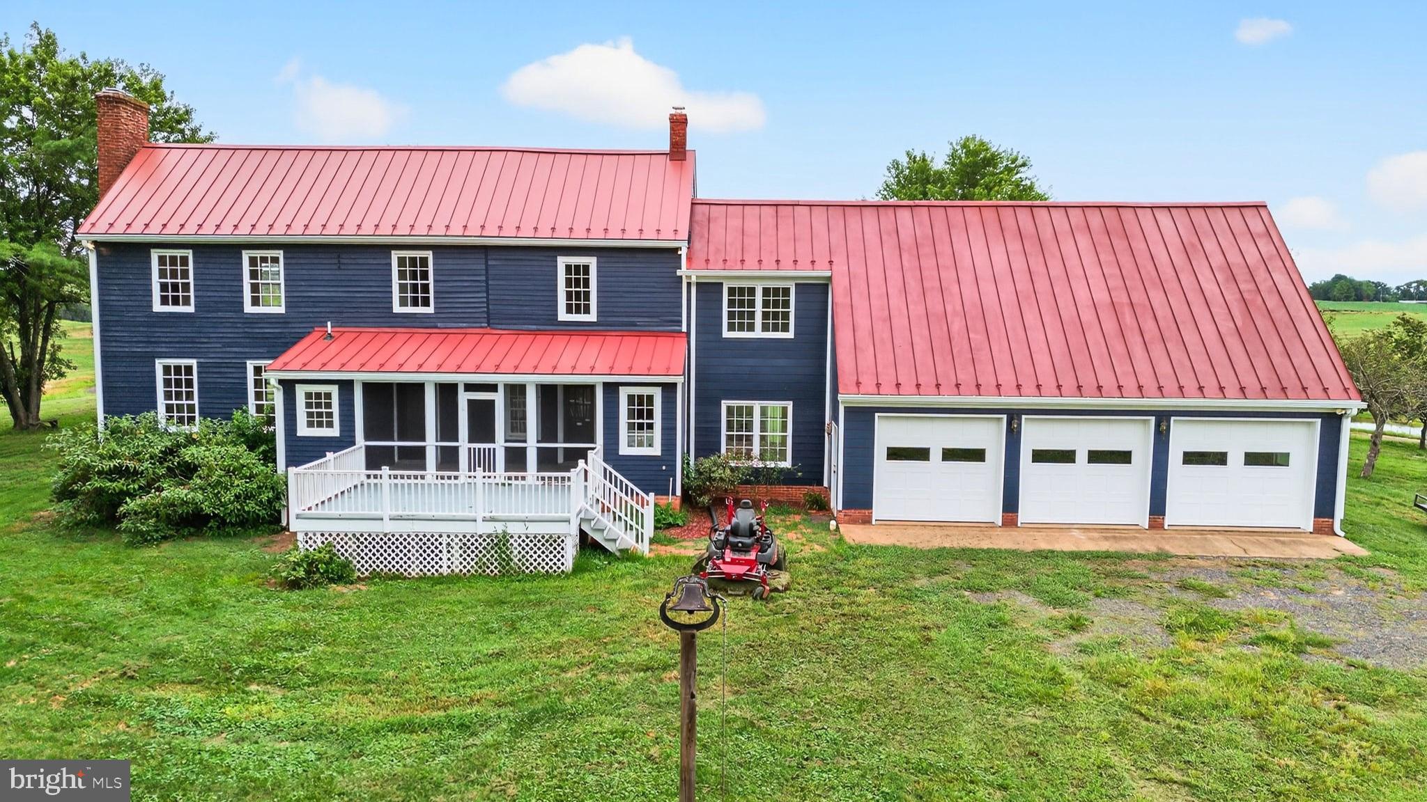 9534 Spring Hill Lane Rixeyville, VA 22737 - Photo 29 of 70 a front view of a house with garden