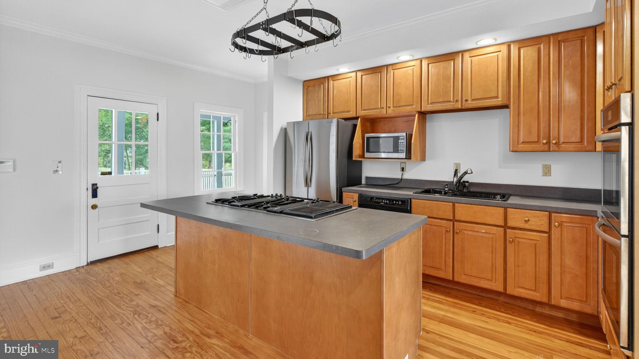 9534 Spring Hill Lane Rixeyville, VA 22737 - Photo 37 of 70 a kitchen with stainless steel appliances granite countertop a stove a sink dishwasher and a refrigerator