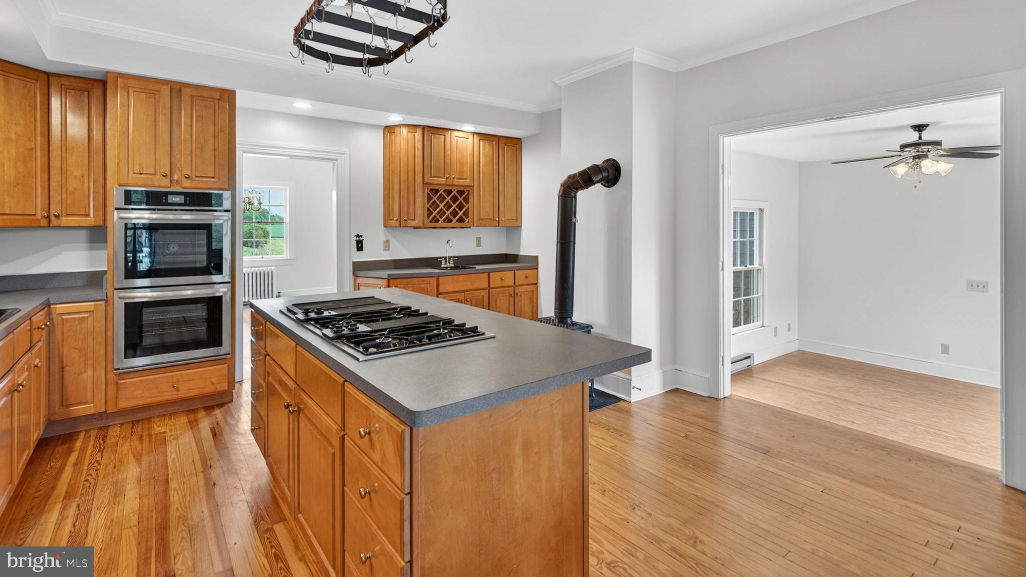 9534 Spring Hill Lane Rixeyville, VA 22737 - Photo 38 of 70 a kitchen with stainless steel appliances granite countertop a stove a refrigerator and a microwave