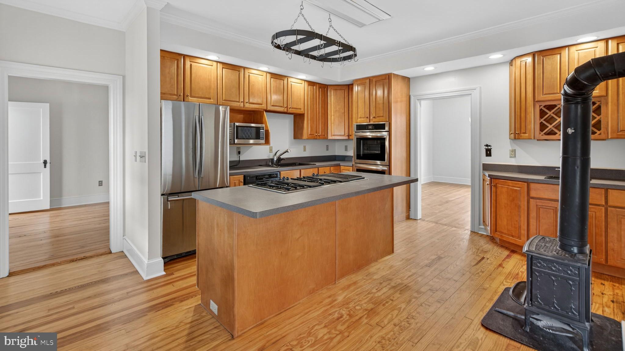 9534 Spring Hill Lane Rixeyville, VA 22737 - Photo 39 of 70 a kitchen with stainless steel appliances granite countertop a refrigerator and a stove top oven