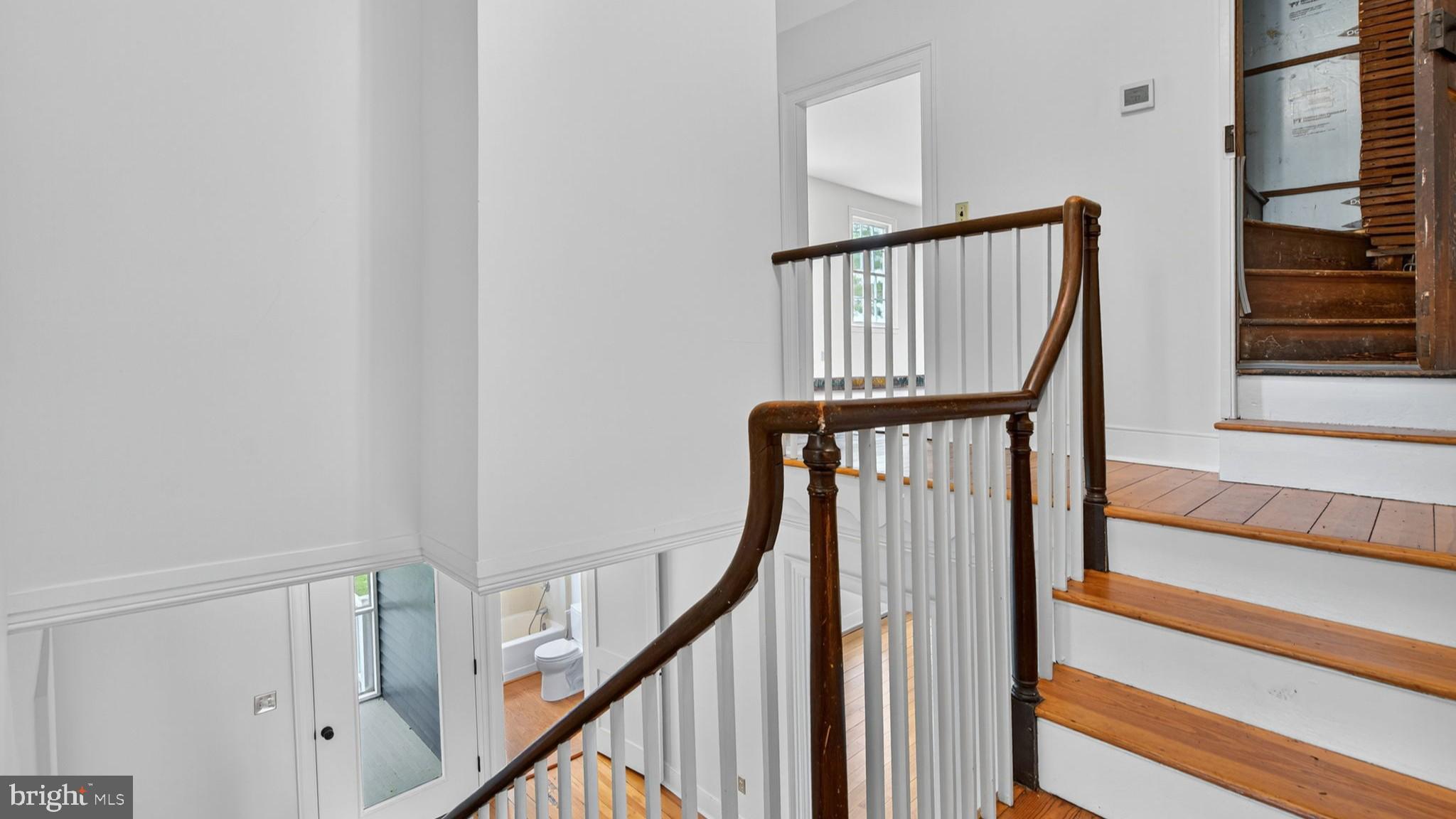 9534 Spring Hill Lane Rixeyville, VA 22737 - Photo 45 of 70 a view of staircase with wooden floor and white walls