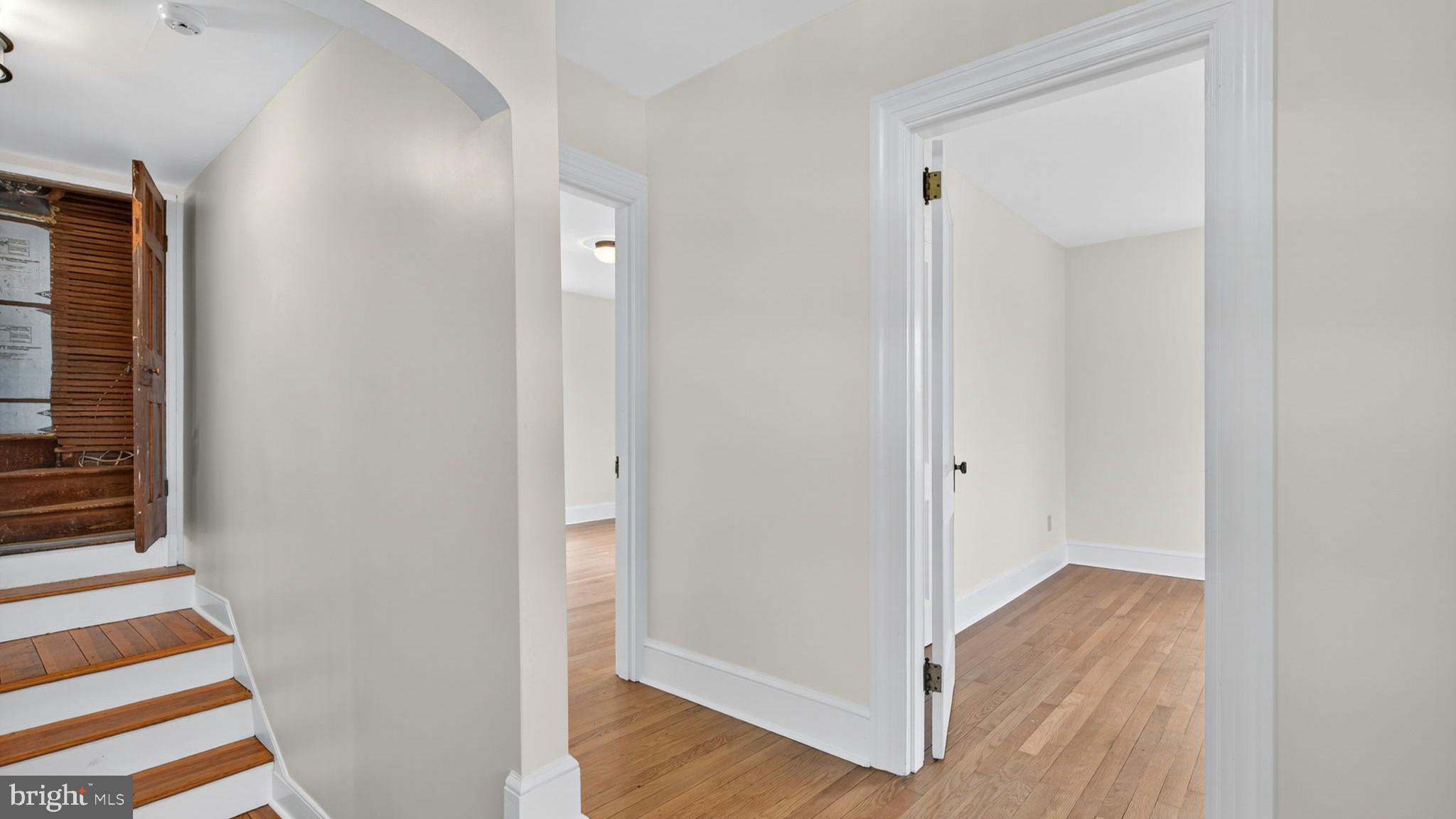 9534 Spring Hill Lane Rixeyville, VA 22737 - Photo 49 of 70 a view of a hallway with wooden floor and a bathroom