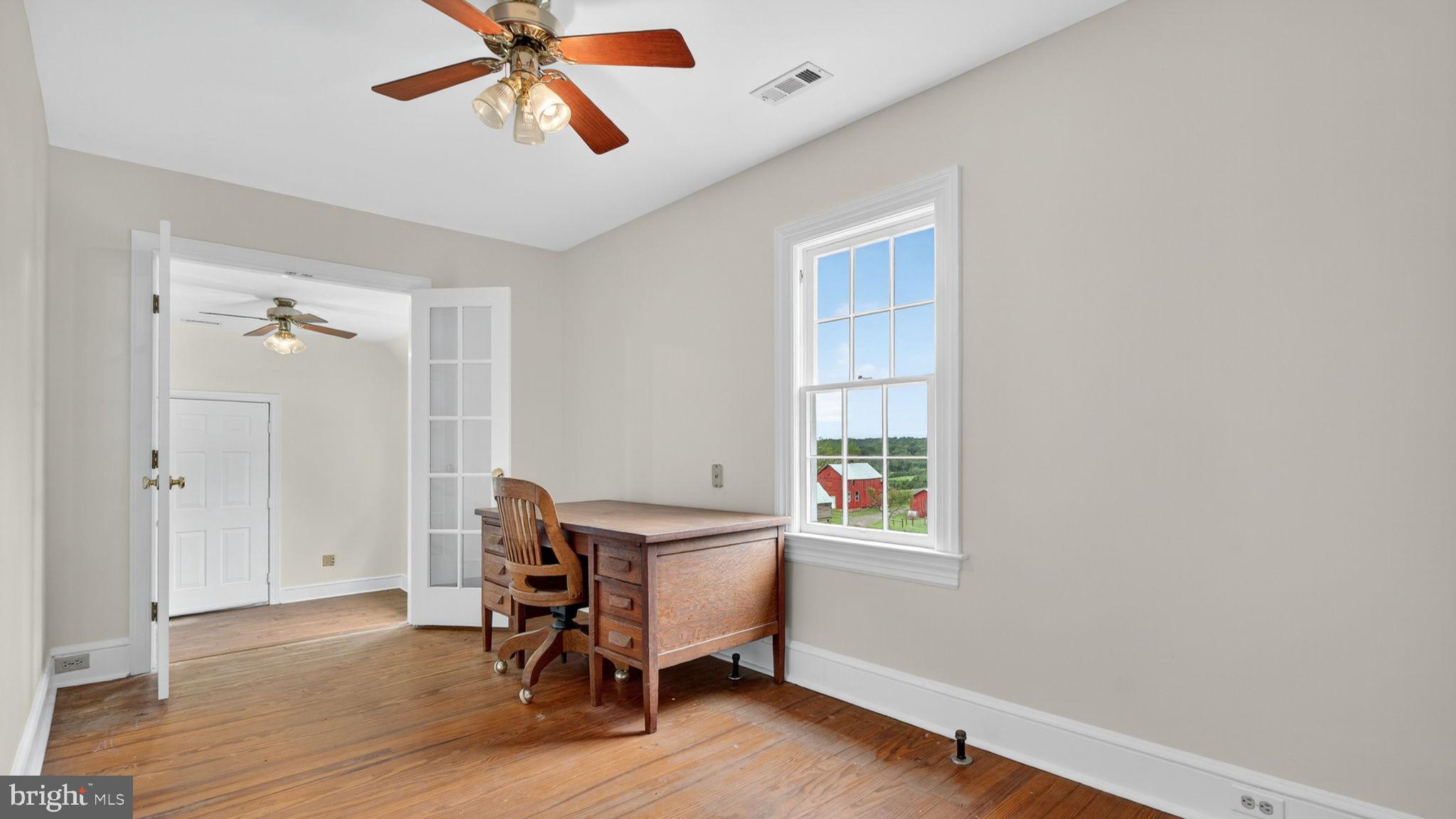 9534 Spring Hill Lane Rixeyville, VA 22737 - Photo 50 of 70 a workspace with wooden floor and windows