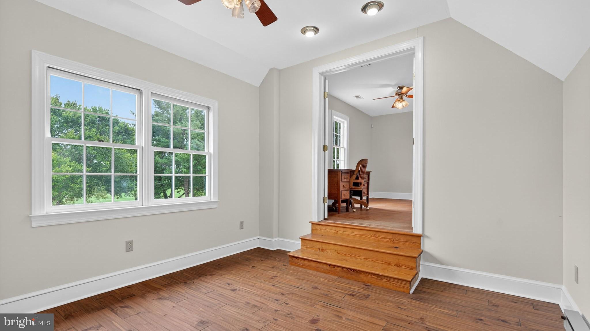 9534 Spring Hill Lane Rixeyville, VA 22737 - Photo 51 of 70 an empty room with wooden floor and a window