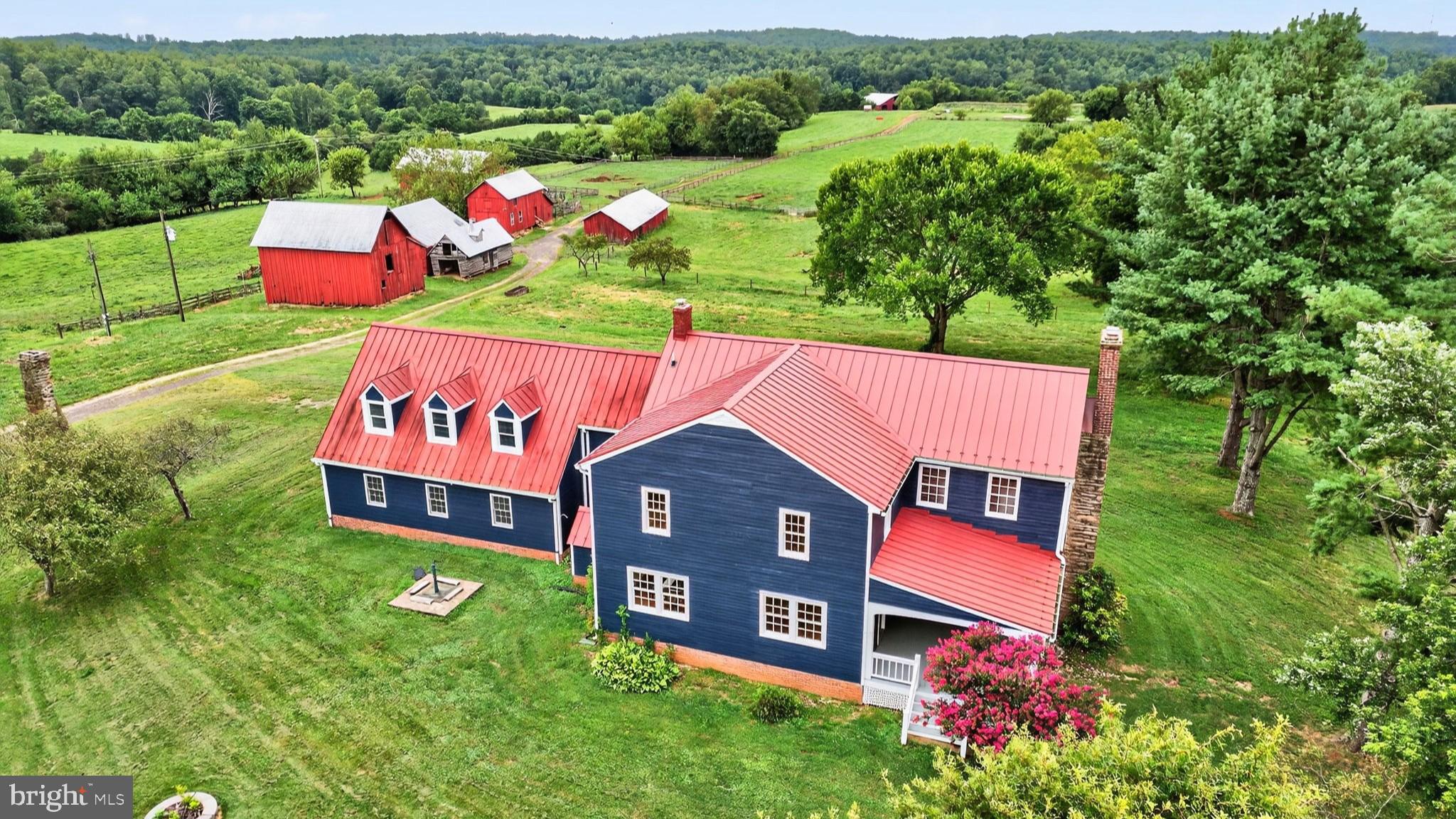 9534 Spring Hill Lane Rixeyville, VA 22737 - Photo 61 of 70 an aerial view of a house with pool yard and mountain view in back