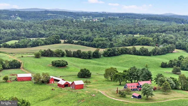 a view of a big yard with lots of green space and mountain view
