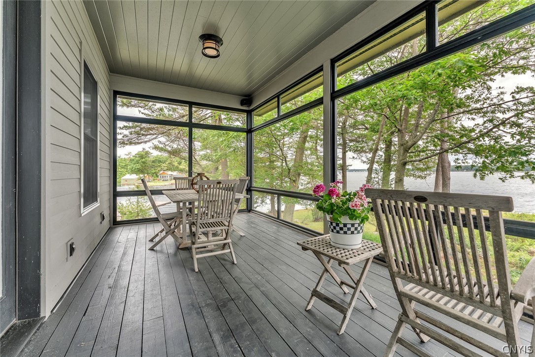 48992 Sylvan Alexandria, NY 13607 - Photo 25 of 50 Screened porch with dining area