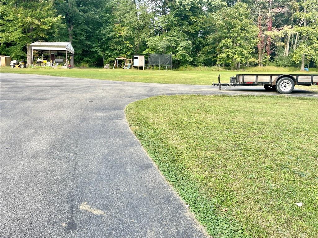 1381 Edmon Road Apollo, PA 15613 - Photo 3 of 29 a view of a swimming pool with a yard and sitting area