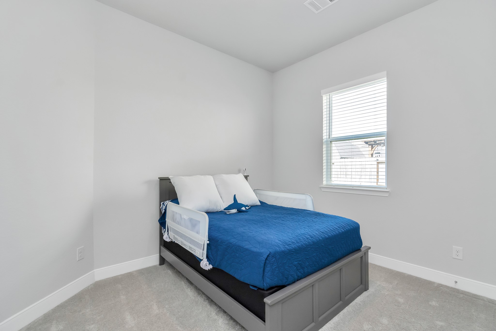 28646 Monarch Cliffs Drive Fulshear, TX 77441 - Photo 11 of 33 a bedroom with a bed and window