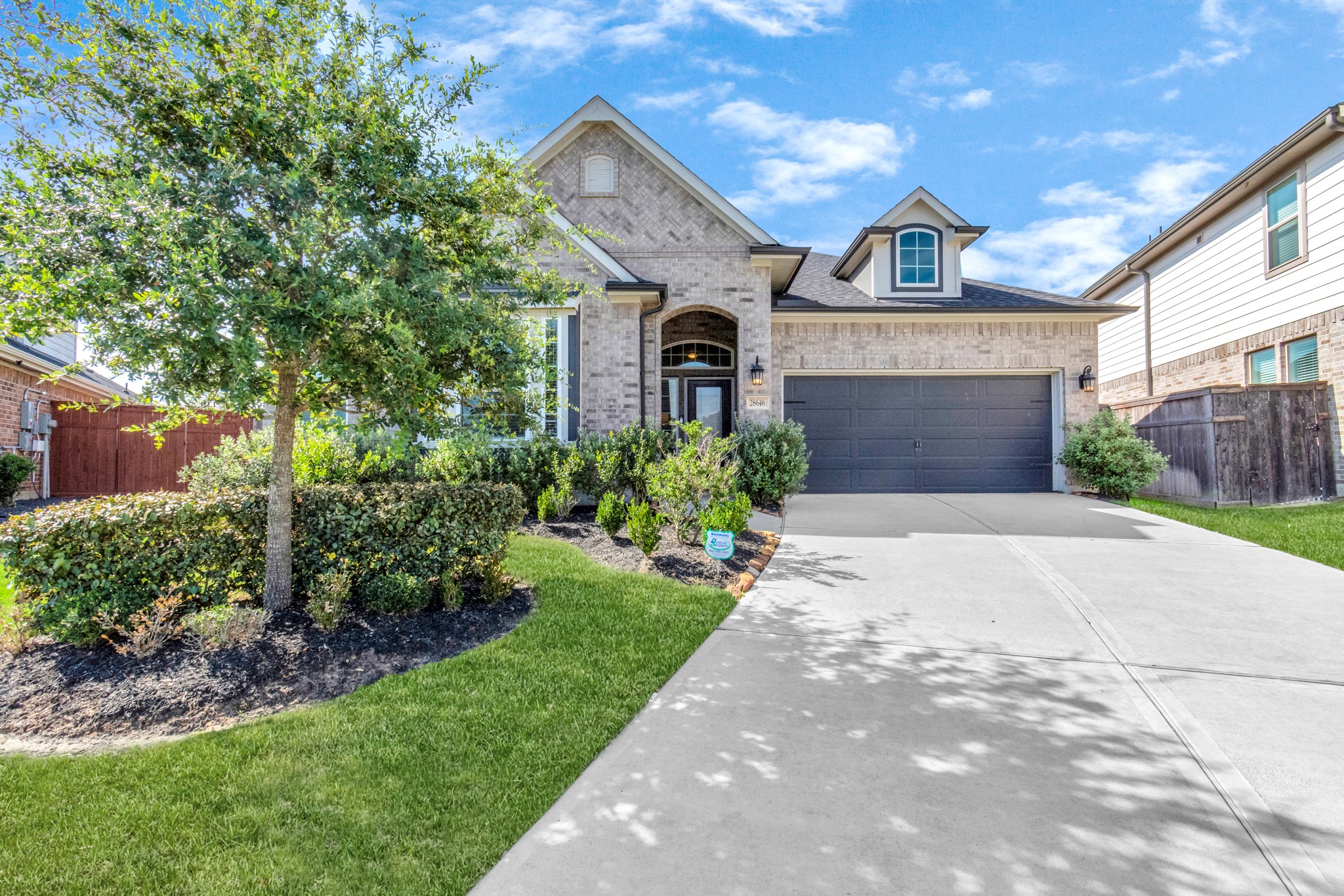 28646 Monarch Cliffs Drive Fulshear, TX 77441 - Photo 2 of 33 a front view of a house with a garden