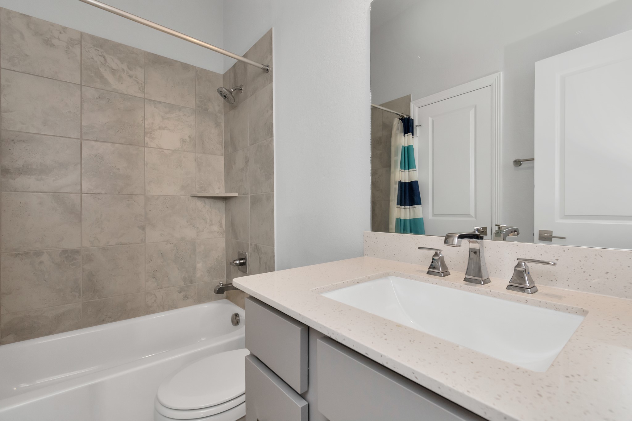 28646 Monarch Cliffs Drive Fulshear, TX 77441 - Photo 24 of 33 a bathroom with a granite countertop sink toilet and shower