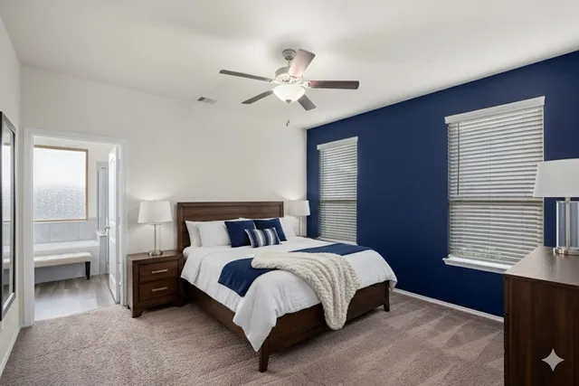 a bedroom with a bed and window