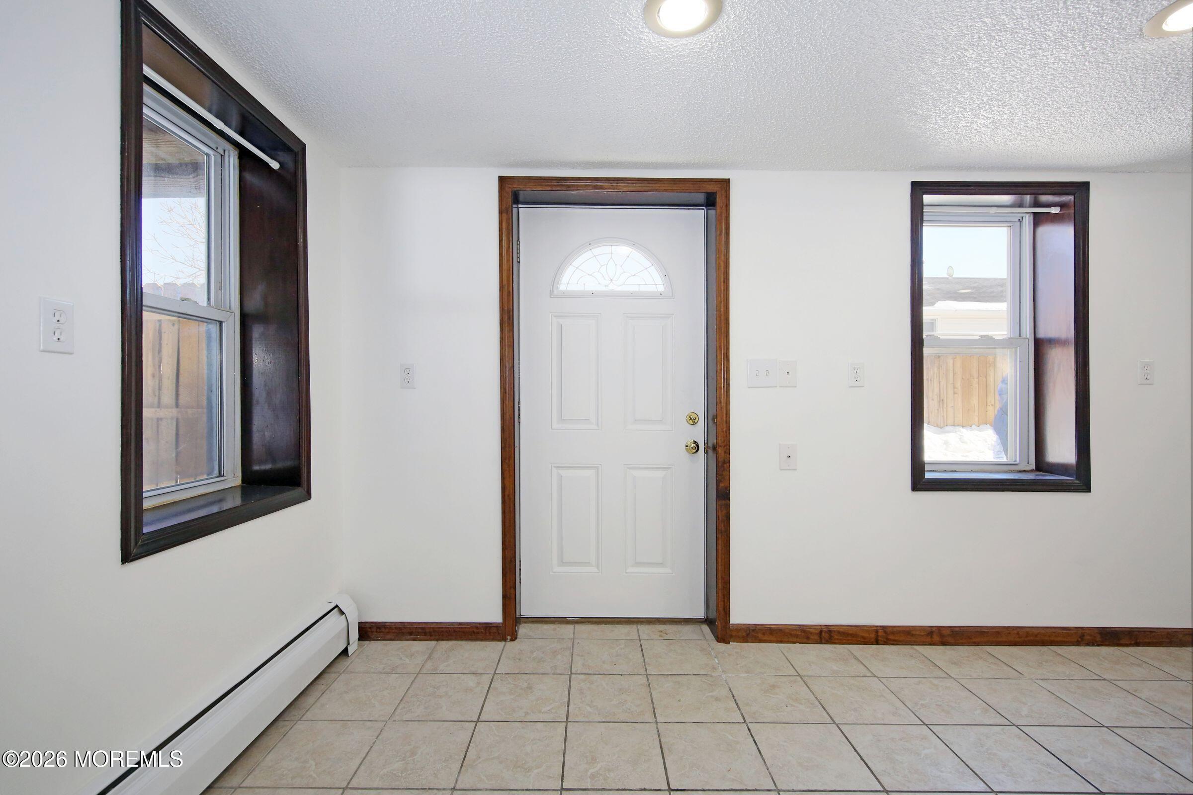 60 Matthew Street, Unit 1 Highlands, NJ 07732 - Photo 2 of 33 an empty room with windows