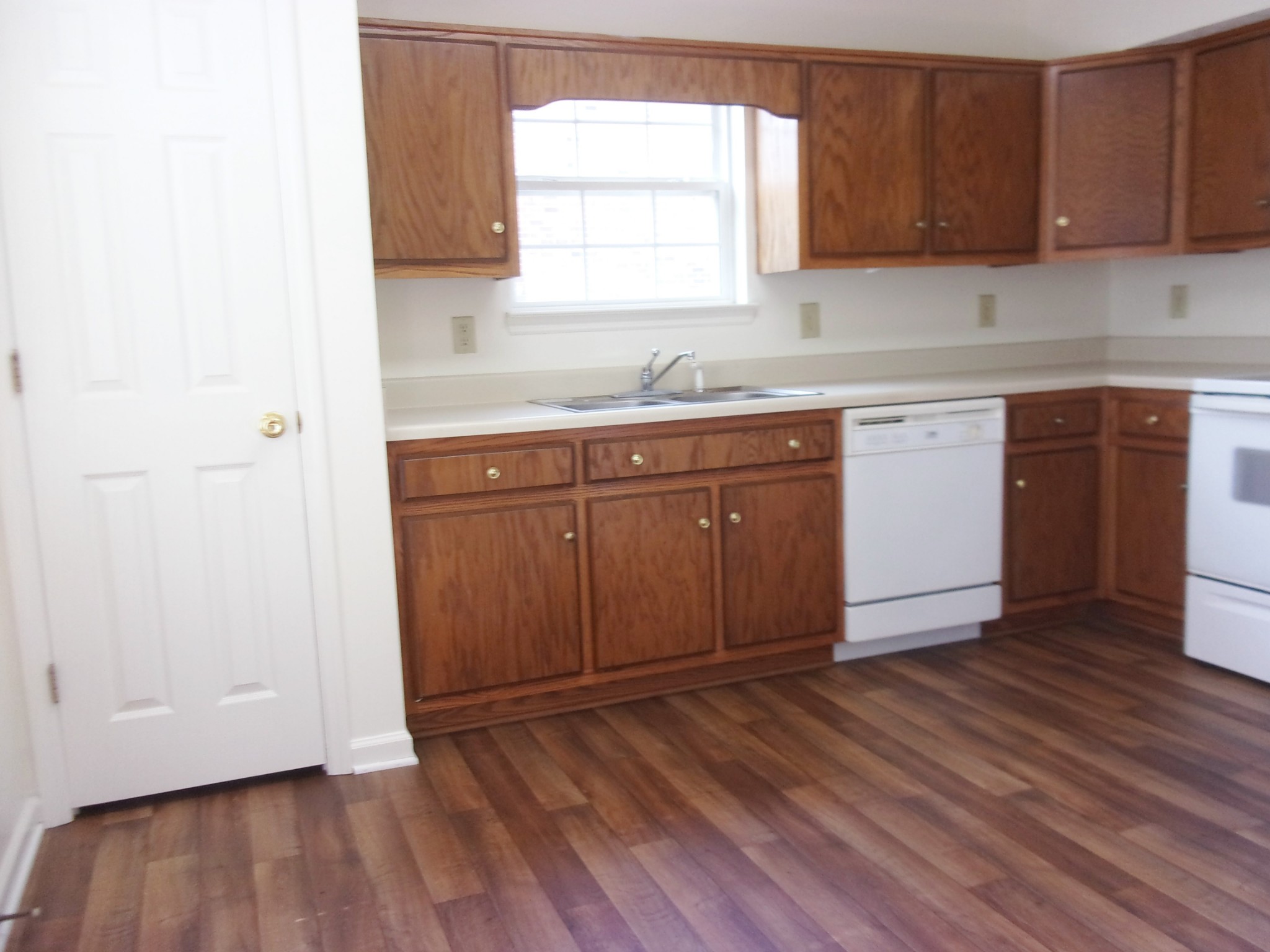 235 Hidden Acres, Unit A Lebanon, TN 37087 - Photo 5 of 14 a kitchen with granite countertop wooden floors and sink