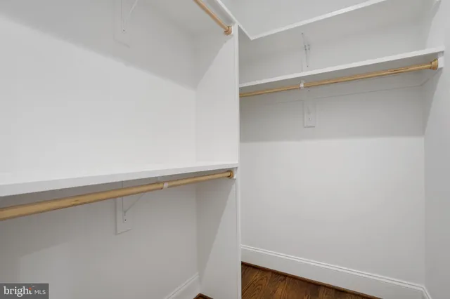 a view of an empty walk in closet