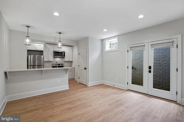 a view of a kitchen with a sink and a stove top oven